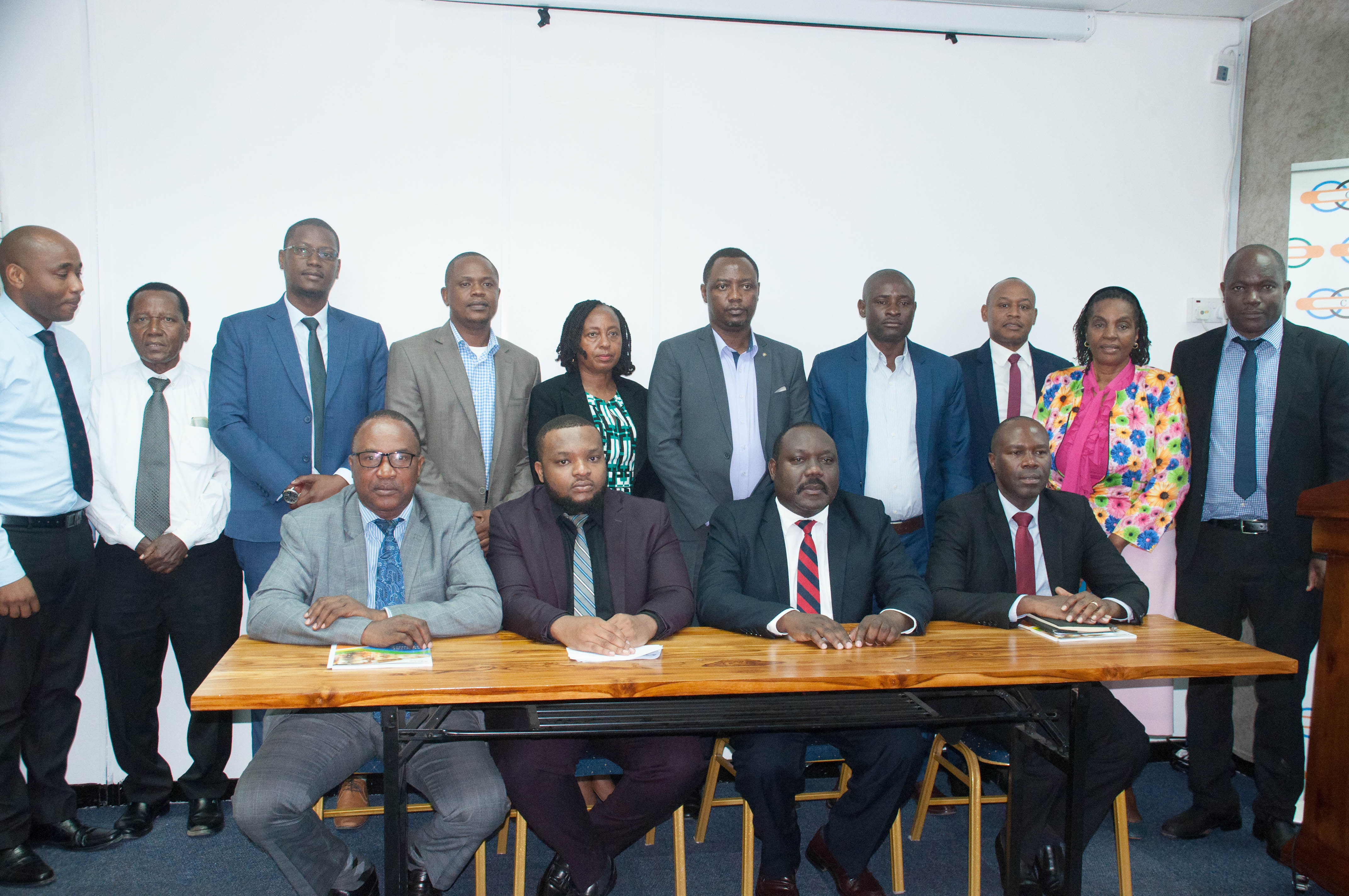 CMSA's CEO Nicodemus Mkama (seated second right) in a  group photo for Tanzania Stock Exchange Brokers Association (TSEBA) representatives. (1)